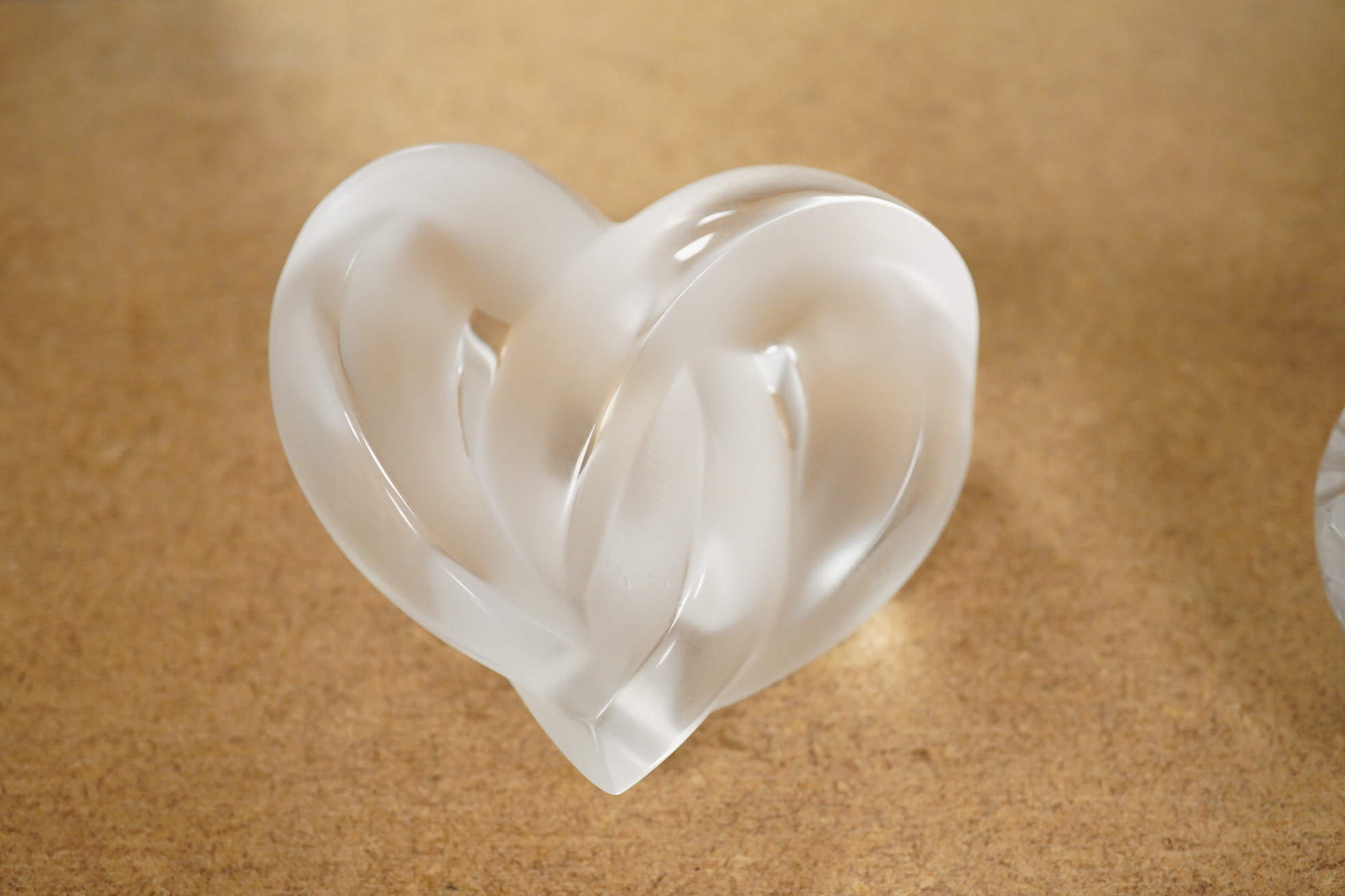 A Lalique scent bottle with stopper, a Lalique lovebirds pin-dish and and a Lalique heart-shape knot, scent bottle 12cm